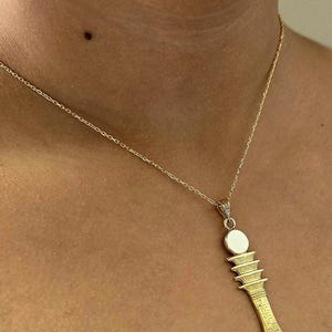 18K gold pendant. Djed pillar-the backbone of Osiris - Egyptian handmade with details' crafts by professionalism in Cairo. don't miss it up