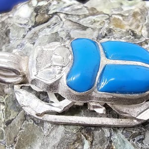 Sacred attractive scarab lying on base colored by (Coral - Turquoise - Blue Lapis and mixed) stones 925 Sterling Silver pendant. Great piece