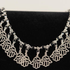 Hamsa Onyx braided charm 925 Sterling Silver bracelet inlaid with stones handmade in our workshop at Khan El Khalili  old Cairo