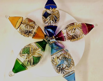Egyptian Blown Glass Ornament – Clear (red/pink/blue /purple/orange) oval drop with gold design. Handmade & create a nice mood around you.