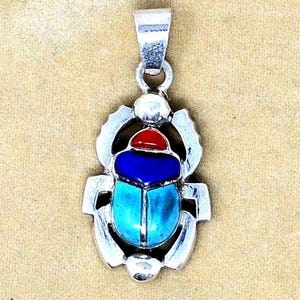 925 sterling silver scarabs with sun disc pendant available in turquoise, coral& lapis, it is an amazing handmade you deserve.
