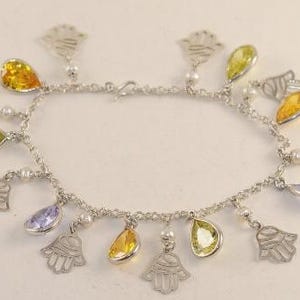 Amazing Hamsa Onyx braided charm bracelet inlaid with stones handmade in our workshop in Khan El Khalili in old Cairo by skilled craftsmen