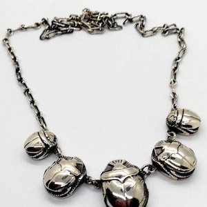 Unique scarabs necklace, 925 sterling silver, Famous pharaonic symbol decorate your neck. Egyptian handmade in our old workshop in old Cairo