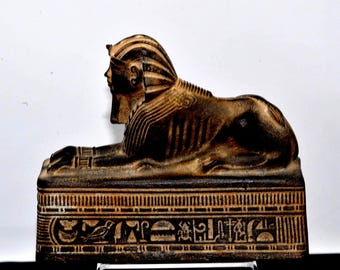 Egyptian statue sphinx - made in Egypt by craftsmen. One of the pharaonic civilization symbols between your hand. From Egypt with love