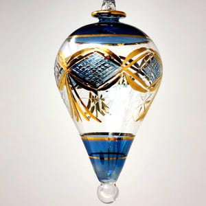 Wonderful Egyptian handmade Blown Glass Ornament – oval drop with gold design accents. A nice piece to decorate your areas