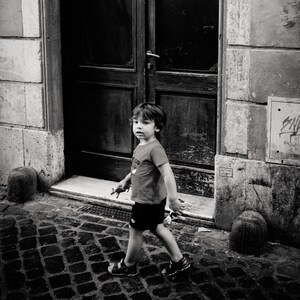 boy walking, Rome, Italy 2019.