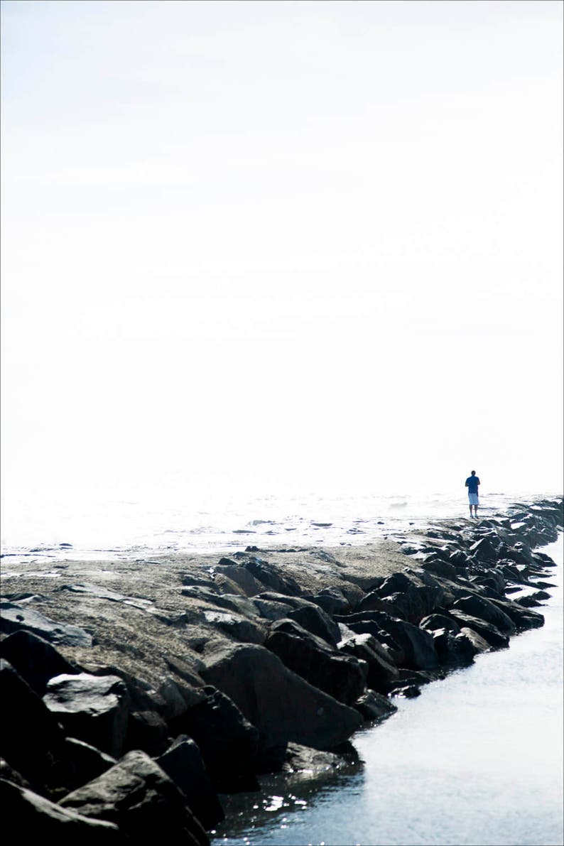 man on rocky shore, Avalon NJ 2016. image 1