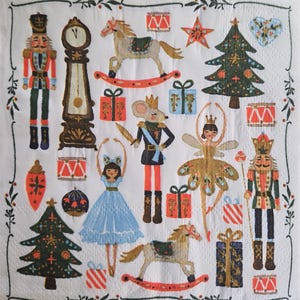 May include: A white napkin with a festive Christmas design. The illustration features a clock, nutcrackers, rocking horses, wrapped gifts, Christmas trees, and a ballerina. The color palette includes red, green, gold, and blue.