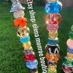 May include: Three colorful beaded wands with glass beads, crystal beads, and gold spacers. The wands are topped with a clear glass diamond shape. The text "Etsy Shop: elena monroe boutique" is visible in the image.