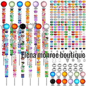 May include: A set of DIY beaded pens featuring metal rods, assorted colorful acrylic beads, faceted crystal toppers, and various metal charms. The collection includes individual beads, silver-toned nuts, and the text Elena Monroe Boutique.