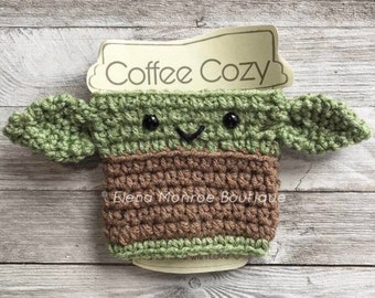 Crochet baby green  Alien Cup Cozy: Galaxy Hero Coffee Sleeve, wise and powerful warrior