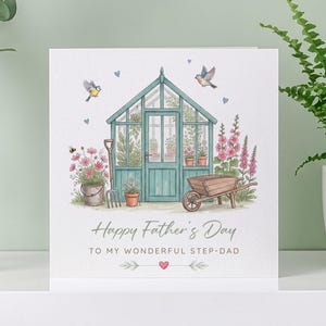May include: A Father's Day card with a watercolour illustration of a teal greenhouse, flowers, and garden tools. The card reads "Happy Father's Day" and "To My Wonderful Step-Dad". Includes birds and a wheelbarrow.