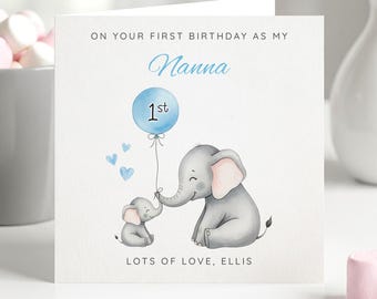 May include: A square greeting card featuring a watercolour illustration of a large grey elephant and a small grey elephant. The large elephant holds a blue balloon with the text 1st. Text reads ON YOUR FIRST BIRTHDAY AS MY Nanna and LOTS OF LOVE, ELLIS.