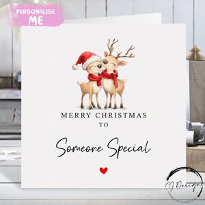 Kerstkaart voor iemand speciaal: kaart liefdevol rendierenpaar en rood hart