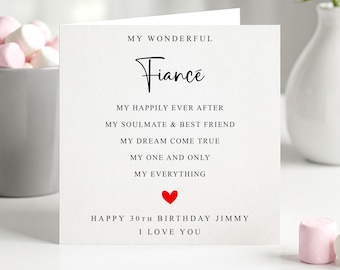 May include: A white card with the word "Fiancé" in stylish script. The card includes the phrases "My Happily Ever After," "My Soulmate & Best Friend," and "Happy 30th Birthday Jimmy." A small red heart is also visible.