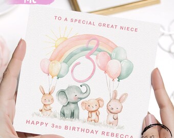 May include: A birthday card with a watercolour design. The card features a rainbow, balloons, and the number 3. The card also has illustrations of an elephant, a bear, and two bunnies. The text reads "Happy 3rd Birthday Rebecca".