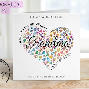 May include: A white greeting card with the text "To My Wonderful Grandma" and "Happy 80th Birthday." The card features a heart made of colorful hearts and the word "Grandma" in the center. The card is on a wooden surface.