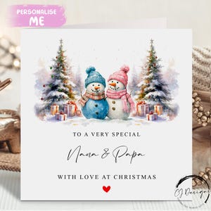 Tarjeta navideña de Nana y Papa: Tarjeta con escena navideña de abuelos, muñeco de nieve y corazón rojo