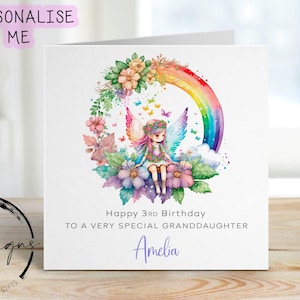 Może przedstawiać: Spersonalizowana kartka urodzinowa z akwarelową ilustracją wróżki, tęczy i kwiatów. Na kartce napisano: "Happy 3rd Birthday To A Very Special Granddaughter Amelia".