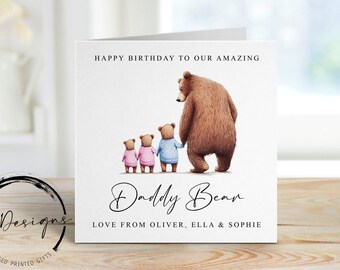 May include: A greeting card with a watercolor illustration of a bear family. The card reads "Happy Birthday to Our Amazing Daddy Bear" with the names Oliver, Ella & Sophie. The bears are in pink and blue outfits.