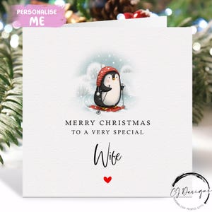 Tarjeta navideña para esposa: tarjeta navideña con pingüino esquiando en la nieve