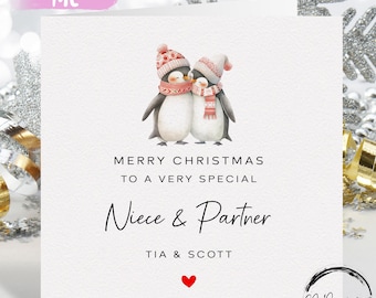 Tarjeta de Navidad personalizada para sobrina y su pareja: tarjeta con pingüinos en pareja y corazón rojo.