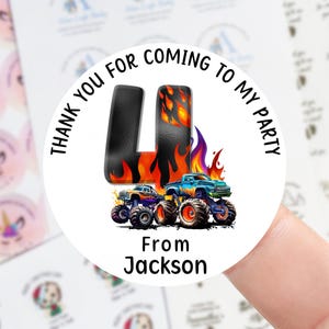 May include: Circular sticker with the words "THANK YOU FOR COMING TO MY PARTY" around a design. The design includes a flaming letter "L", monster trucks, and the name "Jackson". Unicorn stickers are also visible.