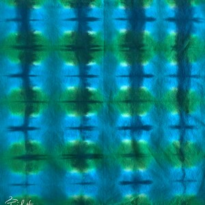 May include: A blue and green tie-dye fabric with a repeating pattern of vertical stripes and horizontal lines.