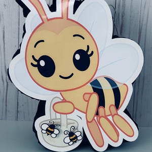 May include: A set of three ceramic mugs with a speckled, matte finish. The mugs are in shades of cream, light gray, and dark gray. Each mug has a simple, minimalist design, perfect for coffee or tea.