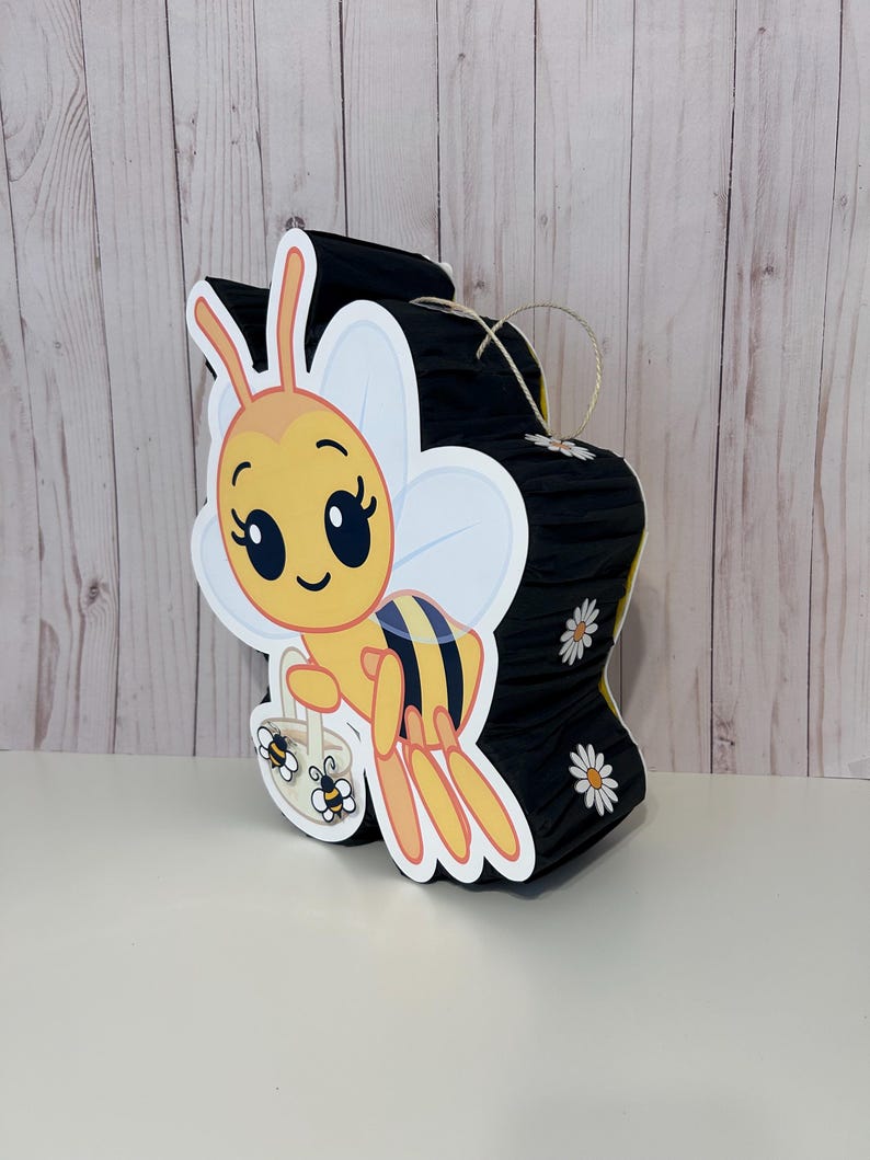 May include: A set of three ceramic mugs with a speckled, matte finish. The mugs are in shades of cream, light gray, and dark gray. Each mug has a simple, minimalist design and a rounded handle.