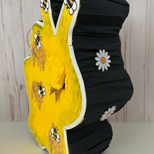 May include: A rustic wooden sign with the text "Welcome to our home" in white lettering. The sign features a distressed finish and a simple, inviting design, perfect for a front porch or entryway.