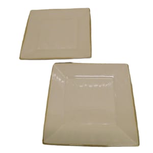 May include: Two square off-white plates with a gold trim. The plates have a slightly raised center and a subtle, elegant design. These plates are suitable for serving appetizers or desserts.