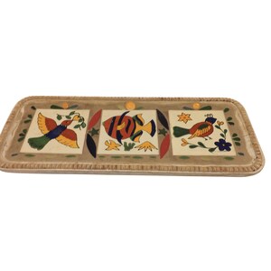 May include: Rectangular ceramic serving tray with a beige border and three square tile inserts. Each tile features a colorful illustration: a bird, a fish, and another bird. The tray has a decorative, textured edge.
