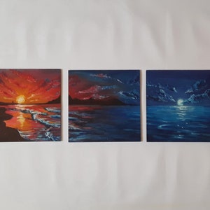 May include: Three paintings depicting a seascape with a sunset, a sunrise, and a moonlit night. The paintings are all in a similar style, with a dark blue background and a light blue foreground. The sunset painting features a bright orange sun setting over the horizon, while the sunrise painting features a bright orange sun rising over the horizon. The moonlit night painting features a bright white moon shining over the horizon.