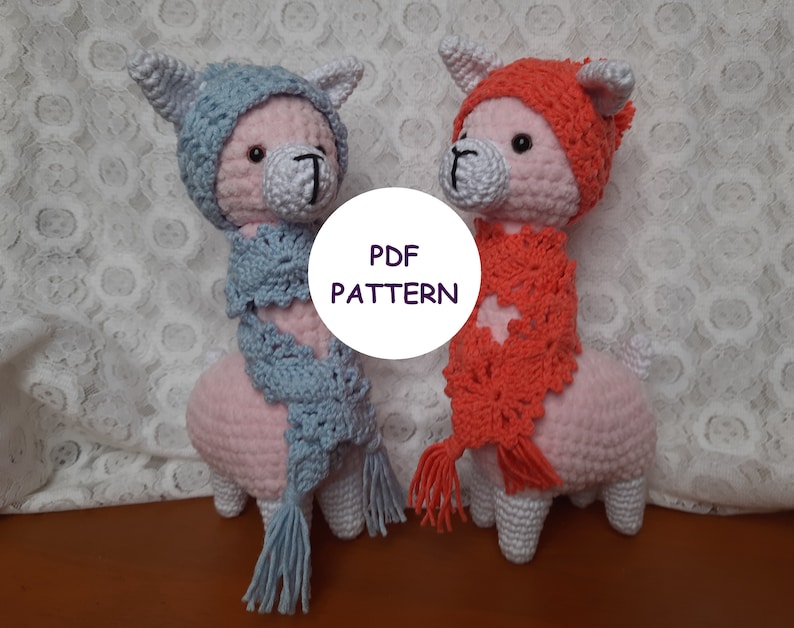 May include: Two crocheted llama amigurumi toys wearing hats and scarves. The llama on the left is wearing a light blue hat and scarf, while the llama on the right is wearing a red hat and scarf. The text "PDF PATTERN" is visible in the image.
