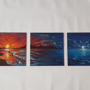 May include: Three small paintings depicting seascapes. The first painting shows a sunset over the ocean with a red and orange sky. The second painting shows a blue sky with clouds and a dark silhouette of a coastline. The third painting shows a dark blue sky with a full moon and a dark blue ocean.