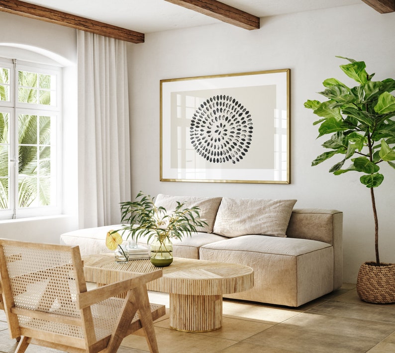 May include: A light beige sectional sofa with a wooden coffee table and a potted plant in the corner. The coffee table has a woven design and a light wood finish. The sofa has a light beige fabric and a modern design. The plant is a fiddle leaf fig with large green leaves.