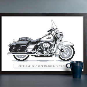 May include: Black and white pixel art illustration of a Harley Davidson motorcycle. The motorcycle is a classic cruiser style with a large front wheel and a sidecar. The image is framed and hanging on a wall.
