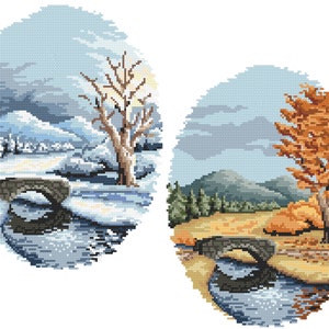 May include: Two oval cross-stitch designs showing seasonal landscapes. One depicts a winter scene with a snow-covered bridge, trees, and mountains. The other features an autumn scene with a bridge, a tree with orange leaves, and a river.