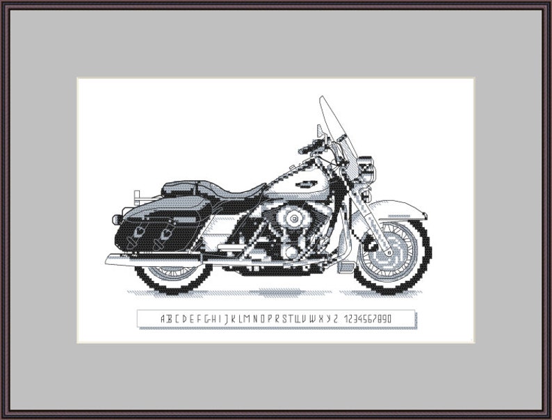 May include: Black and white cross-stitch pattern of a classic motorcycle with a sidecar. The pattern includes a letter and number chart for stitching.