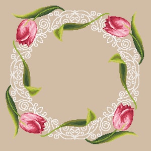 May include: A square frame with a white lace design and pink tulips in the corners. The background is a light brown colour.