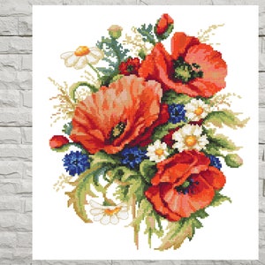 May include: A cross-stitch pattern featuring a bouquet of red poppies, white daisies, and blue wildflowers. The flowers are arranged in a loose, flowing style, with the poppies taking center stage.