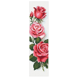 May include: A cross-stitch bookmark featuring three red roses with green leaves against a white background. The roses are in various stages of bloom, with detailed stitching creating a textured appearance. The bookmark is a vertical rectangle.