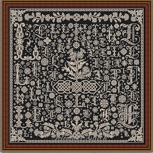May include: A framed cross-stitch sampler with a black background and cream-colored ornate lettering and floral designs. The sampler features various stylized letters and decorative elements. The frame is a dark brown color. The text "INSTANT DOWNLOAD PDF" is at the bottom.