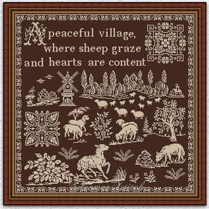 May include: Framed cross-stitch art with a brown background and a pastoral scene. The artwork features sheep grazing in a village with a windmill, trees, and the text "A peaceful village, where sheep graze and hearts are content."