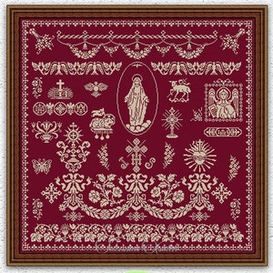 May include: A framed cross-stitch pattern with a burgundy background and white embroidery. The pattern features a variety of religious symbols, including a cross, a heart, a dove, and a sun. The pattern also includes a variety of floral designs and borders.