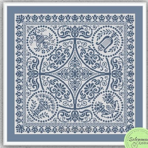 May include: A framed cross-stitch pattern in shades of blue, featuring a symmetrical design with floral and geometric elements. The pattern includes a central medallion and circular motifs. The text "INSTANT DOWNLOAD PDF" is at the bottom.