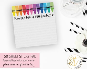 May include: A 50-sheet sticky note pad with a rainbow crayon border and the text "From the desk of Miss Randall". The sticky note pad is personalized with your name and has a custom font color option.