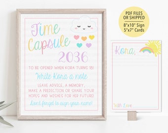 May include: A printable time capsule sign with a rainbow and cloud design. The sign says "Time Capsule 2036" and includes instructions for filling out the time capsule. The sign is 8 inches by 10 inches.