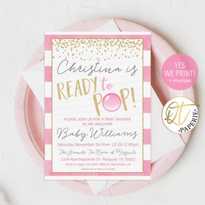 May include: A baby shower invitation with a pink and white striped background. The invitation features the text "Christina is READY to POP!" in gold and pink, with event details below. A pink plate and envelope are in the background.